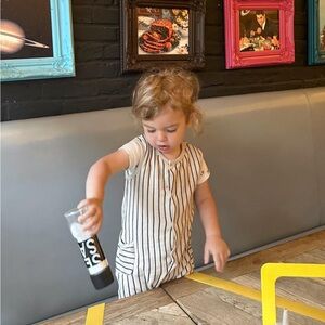 H & m striped romper cream and black one piece 9-12m